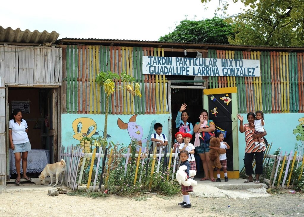 manta, ecuador, women, children, pet, dog, waving, goodbye, animal, building, trees, nature, outside, poverty, poor