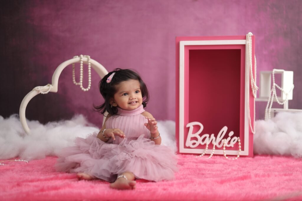 Charming portrait of a baby girl in a pink setting